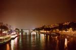 Paris, august 1995. Rolleiflex SL35 + Distagon 35mm, Kodak Gold 100. The Seine at night taken from a bridge. Those lights in the sky are not UFOs, but rather reflections on the skylight filter. Like most people, I keep it on the lens for protection, even in situations such as this when a skylight filter makes absolutely no sense! I've learned my lesson and always remove any filters prior to making a night eggs-posure.