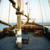 Al Boom, Kuwait, september 1995. Rolleiflex 3.5 B, Kodak Gold 100. On the deck of Mohammedi II. Al Hashemi now towers over the bow of Mohammedi II from the vantage point in this photograph. The container just visible on the right probably indicates that preparations for its construction were already under way back in '95.